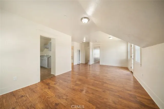 a view of balcony with wooden floor