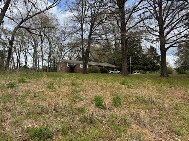 785 Lake Hardeman Road Hickory Valley, TN 38042 - Photo 2 of 10 a view of a yard with a tree