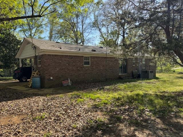 785 Lake Hardeman Road Hickory Valley, TN 38042 - Photo 3 of 10 a view of a house with a yard