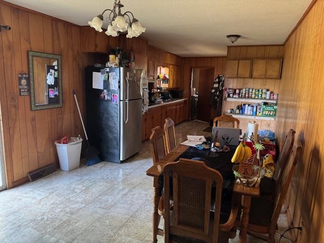 785 Lake Hardeman Road Hickory Valley, TN 38042 - Photo 6 of 10 a view of a dining room with furniture and chandelier