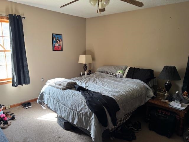 785 Lake Hardeman Road Hickory Valley, TN 38042 - Photo 7 of 10 a bedroom with a bed and window