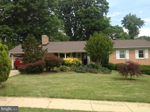 a aerial view of a house with a yard