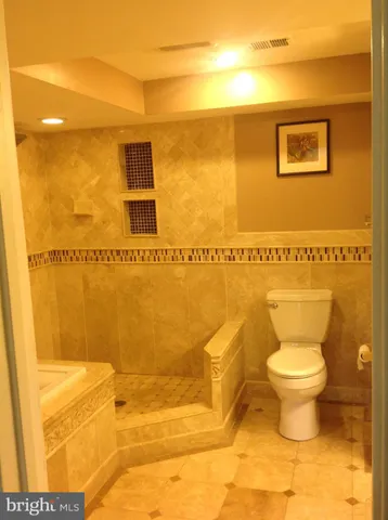 a bathroom with a toilet and a sink