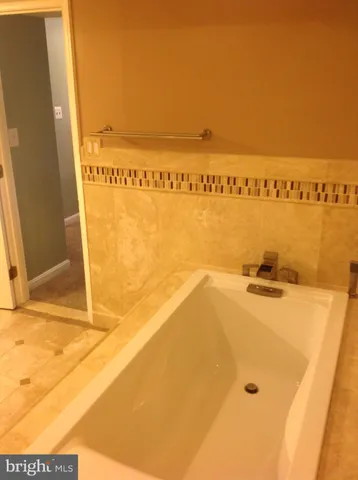 a view of a swimming pool with an outdoor space and seating area