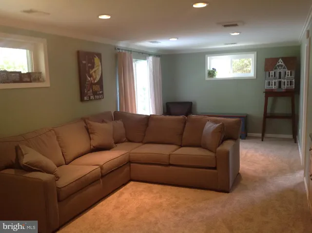 a living room with furniture and windows