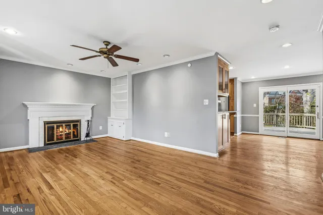 a view of a deck with couches and a fire pit
