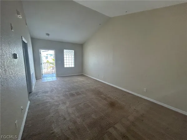 a view of an empty room and window