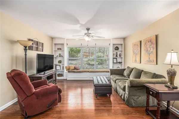 a living room with furniture and a flat screen tv