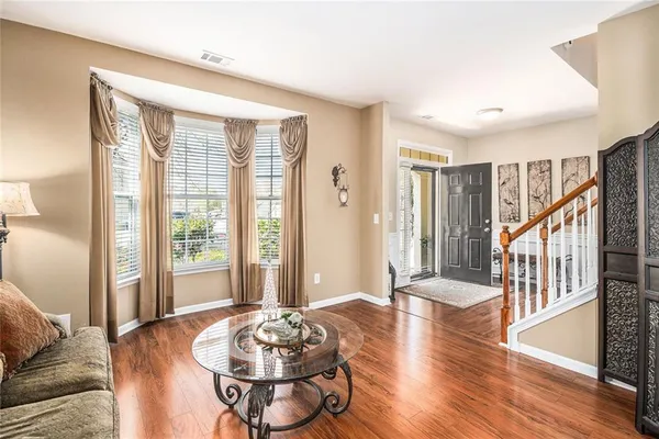 a living room with furniture and a table