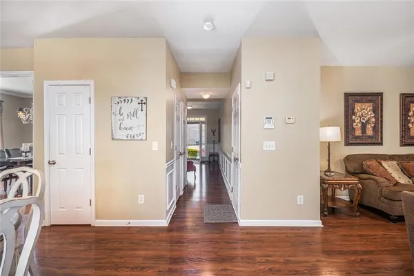 a view of a livingroom with a furniture hardwood floor and a ceiling fan