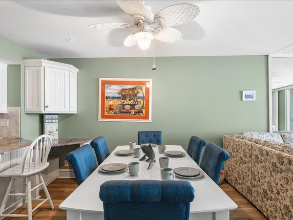 a living room with furniture a desk and chair