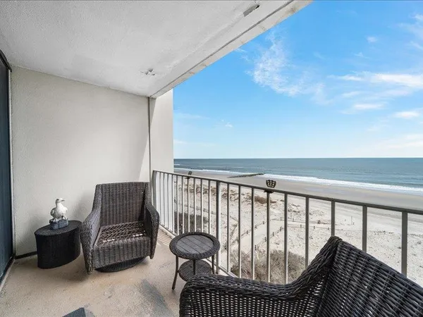 a balcony with furniture