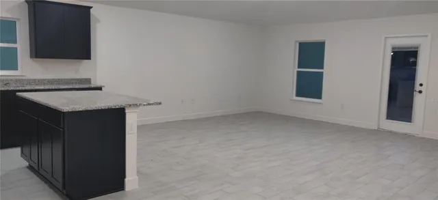 a kitchen with a sink and a mirror