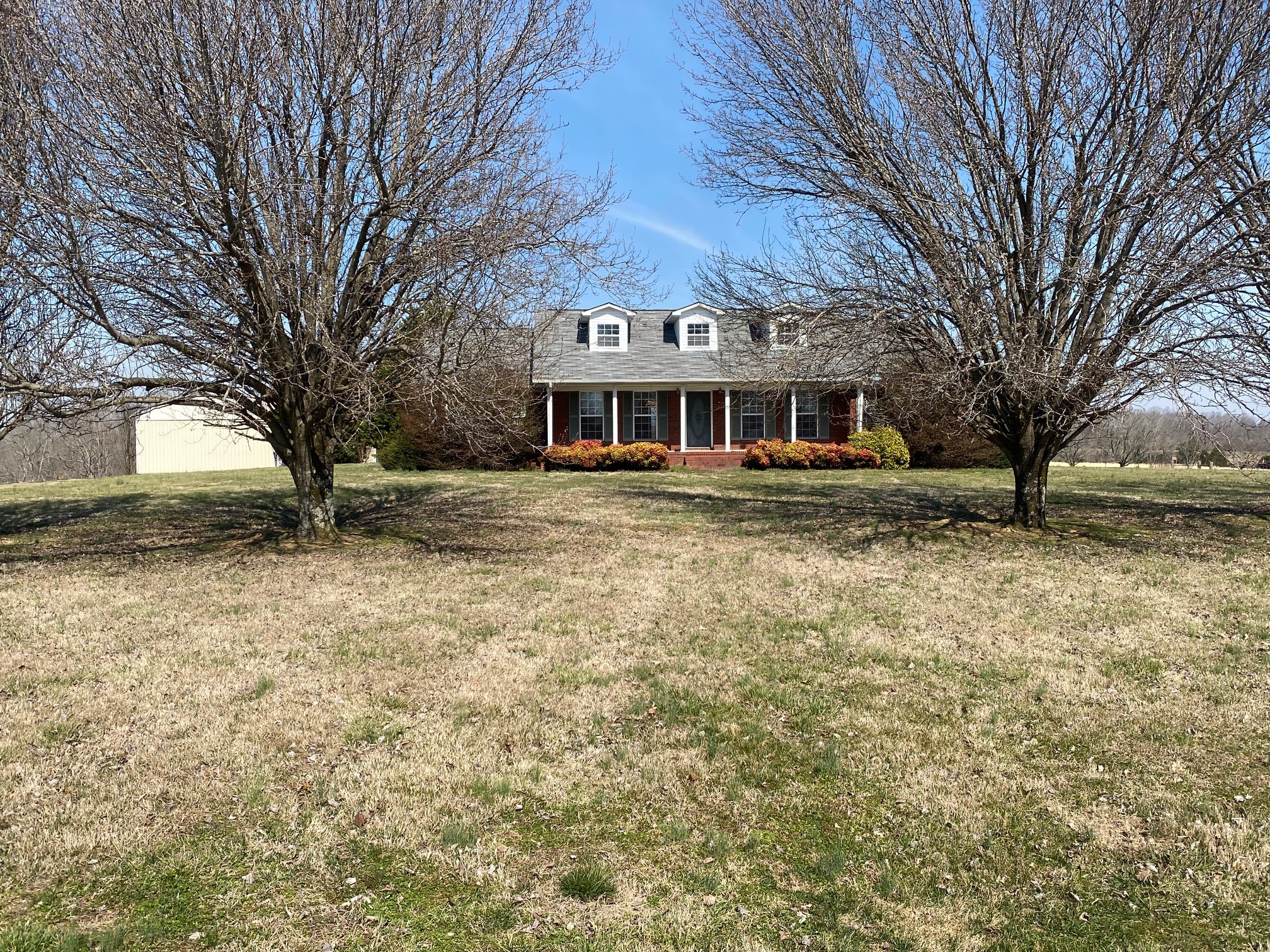 1190 Powell School Road Goodspring, TN 38460 - Photo 3 of 27 a front view of a house with a yard
