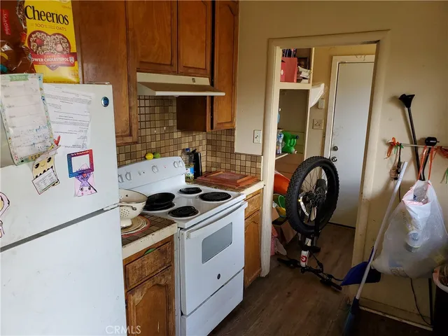 a view of a storage and utility room with washer and dryer