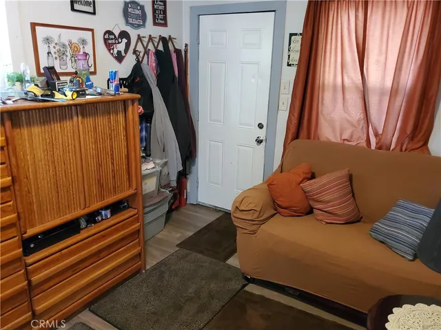 a view of a room with furniture and a window