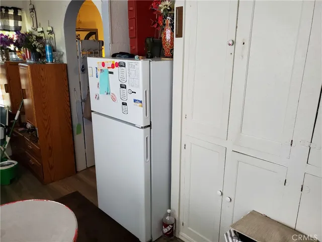 a white refrigerator freezer sitting inside of a kitchen