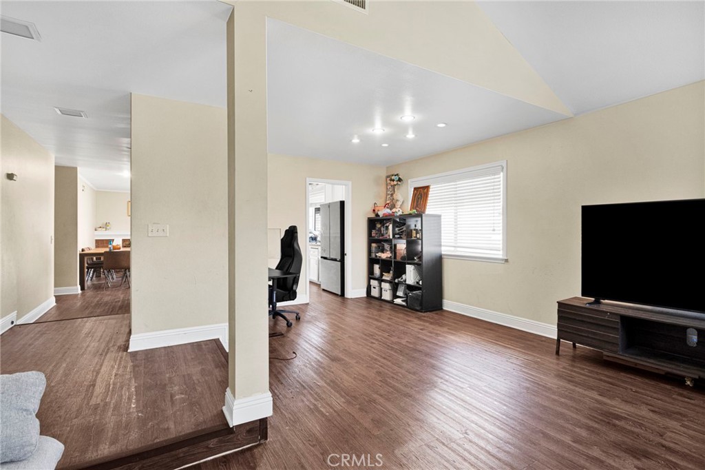 1087 Baseline Road La Verne, CA 91750 - Photo 7 of 39 a view of a livingroom with wooden floor and a flat screen tv