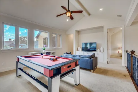 a bedroom with a bed and a table