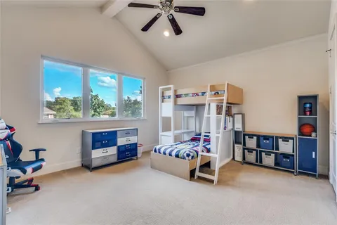 a bedroom with furniture and a window