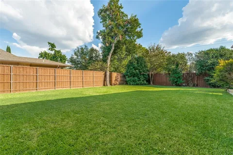 a view of a backyard with a garden