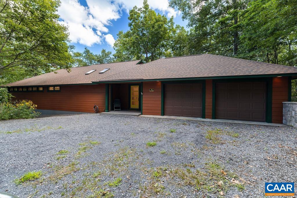 18 Grassy Overlook Wintergreen, VA 22967 - Photo 1 of 65 a house with trees in the background