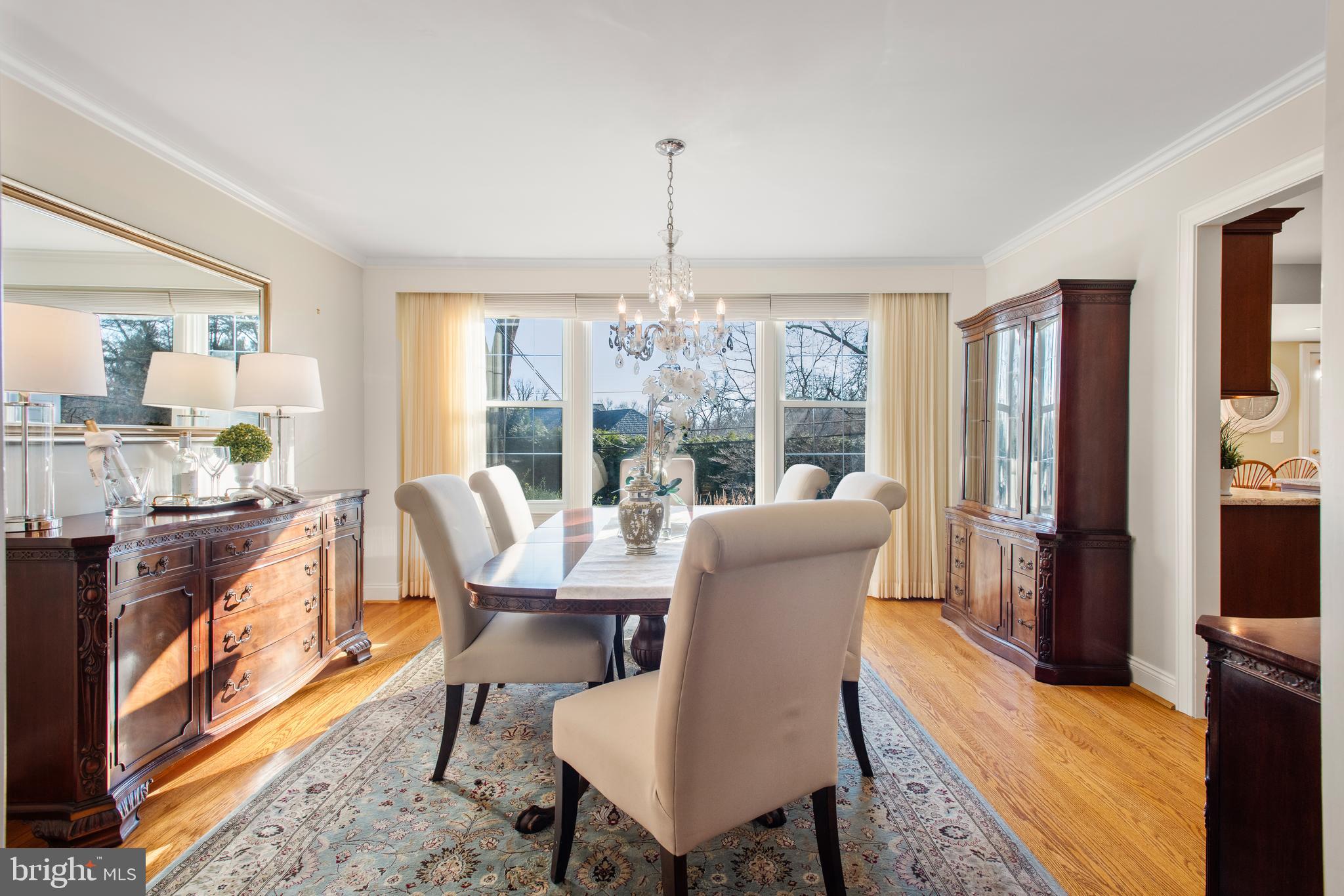 1040 Great Springs Road Bryn Mawr, PA 19010 - Photo 11 of 50 a dining room with furniture a chandelier and wooden floor