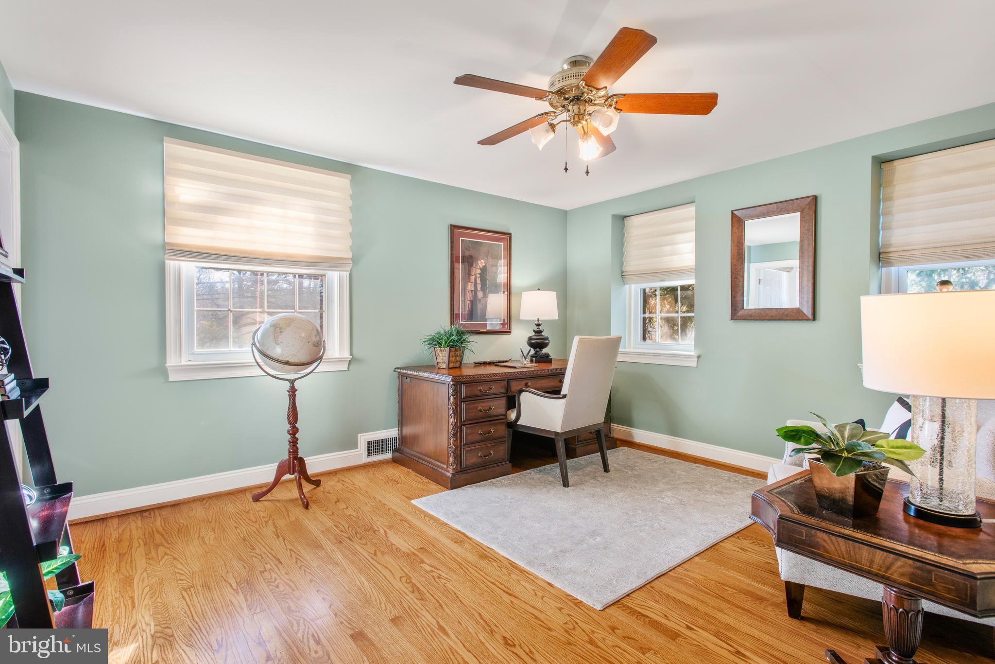 1040 Great Springs Road Bryn Mawr, PA 19010 - Photo 23 of 50 a living room with furniture a chandelier and a window