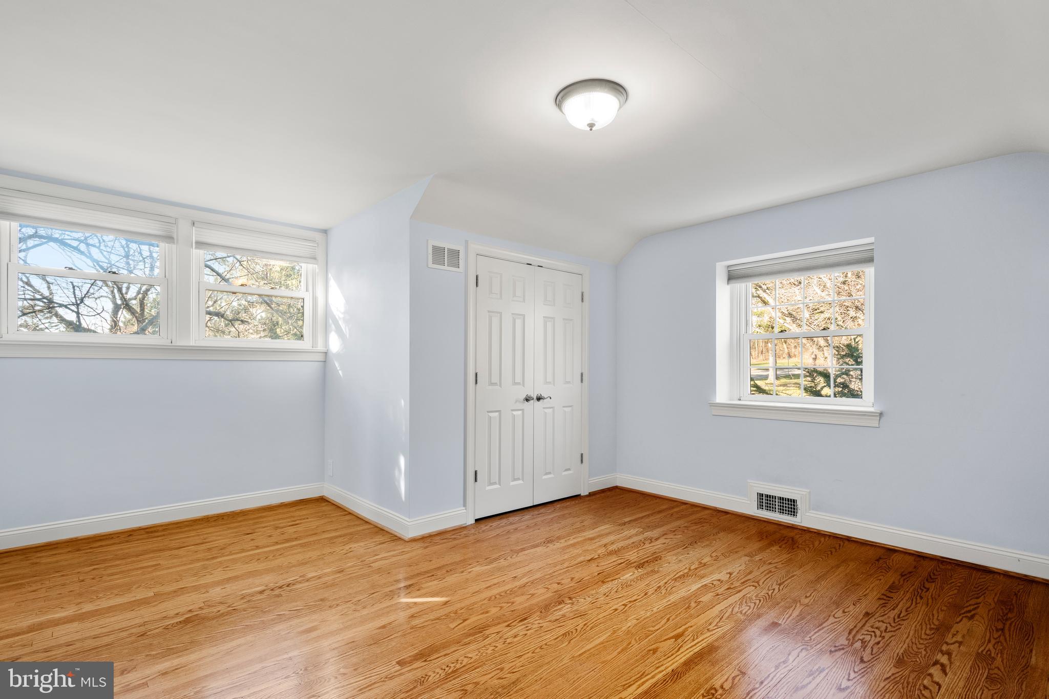 1040 Great Springs Road Bryn Mawr, PA 19010 - Photo 35 of 50 a view of an empty room with wooden floor and a window