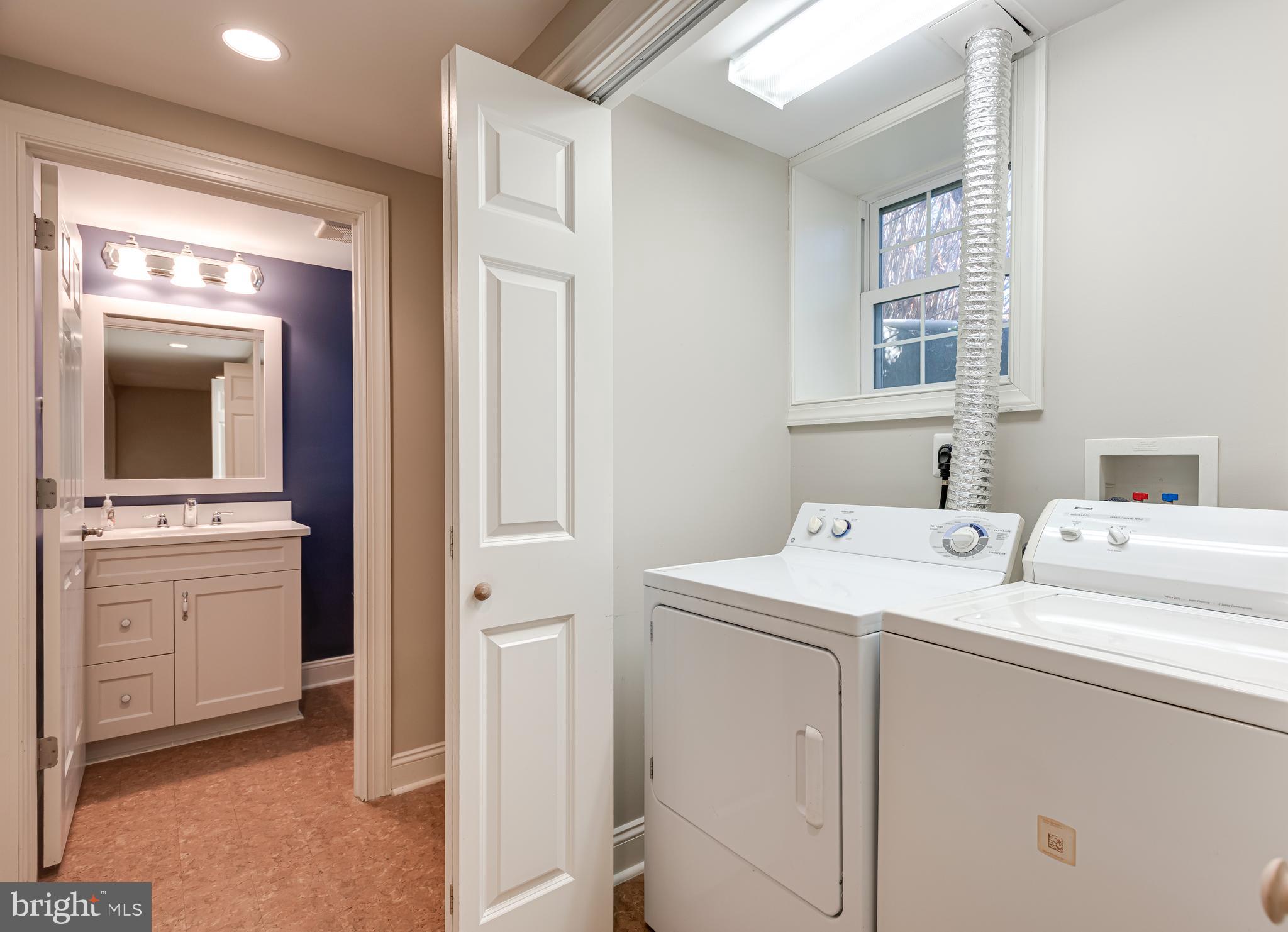 1040 Great Springs Road Bryn Mawr, PA 19010 - Photo 39 of 50 a view of washer and dryer with bathroom in the background