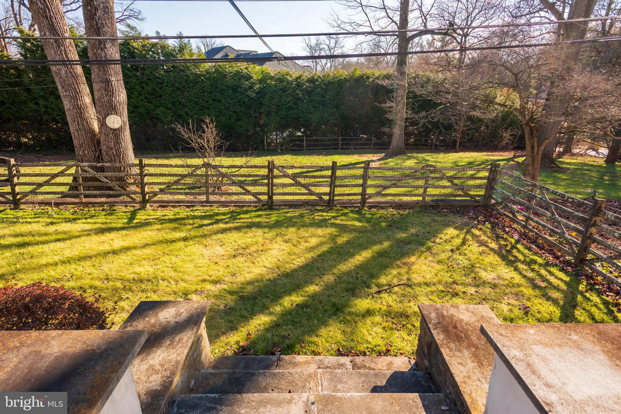 1040 Great Springs Road Bryn Mawr, PA 19010 - Photo 43 of 50 a view of a swimming pool with a patio and a yard