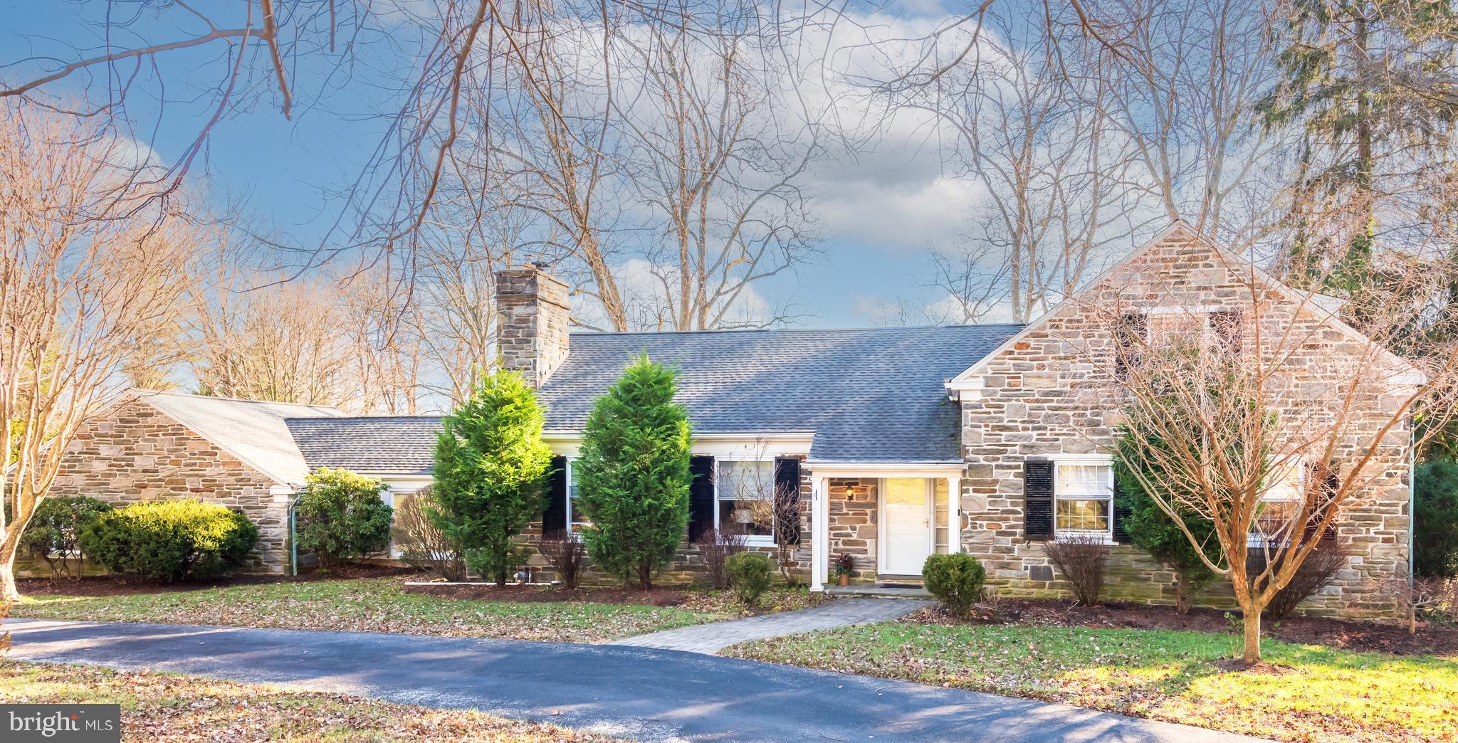 1040 Great Springs Road Bryn Mawr, PA 19010 - Photo 5 of 50 a front view of a house with a yard