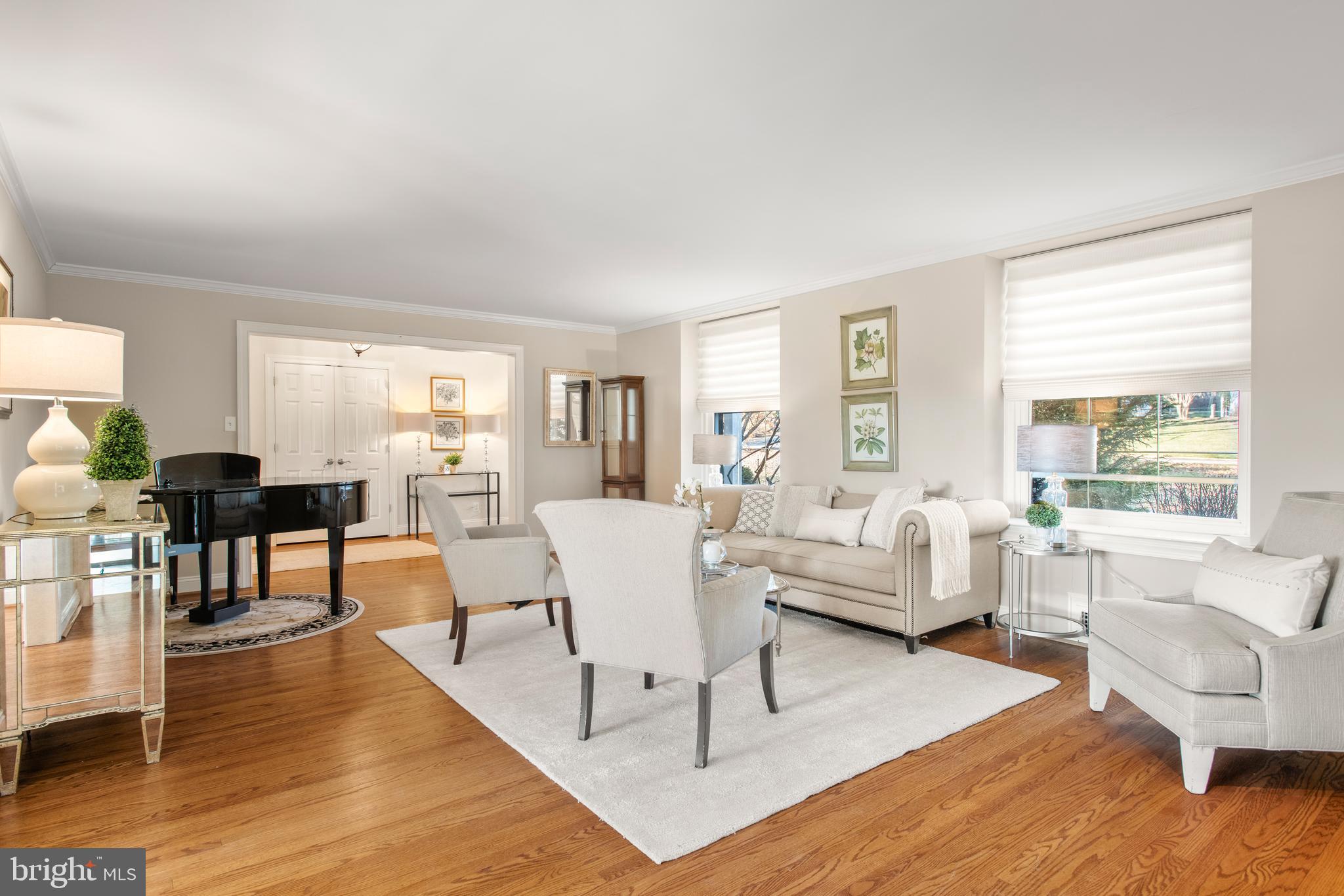 1040 Great Springs Road Bryn Mawr, PA 19010 - Photo 7 of 50 a living room with furniture wooden floor and a large window