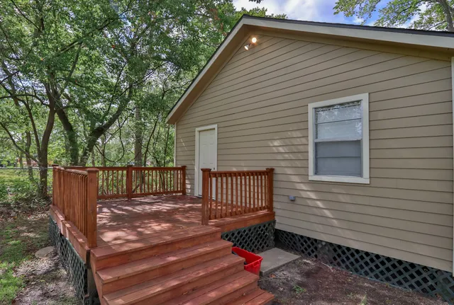 a view of a backyard with a deck