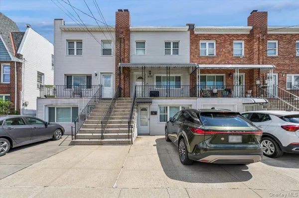 a front view of a house with parking