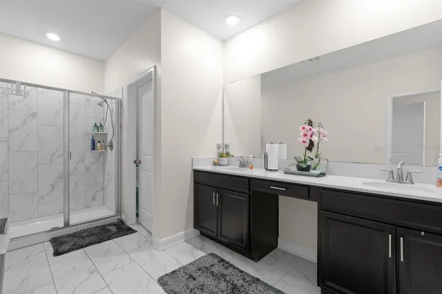 a kitchen with a sink and a mirror