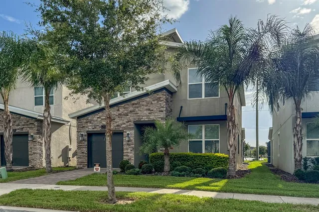 front view of a house with a yard