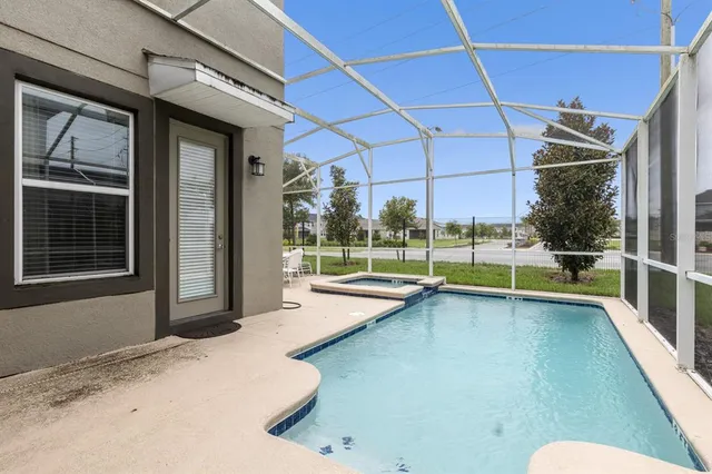 a view of a house with swimming pool