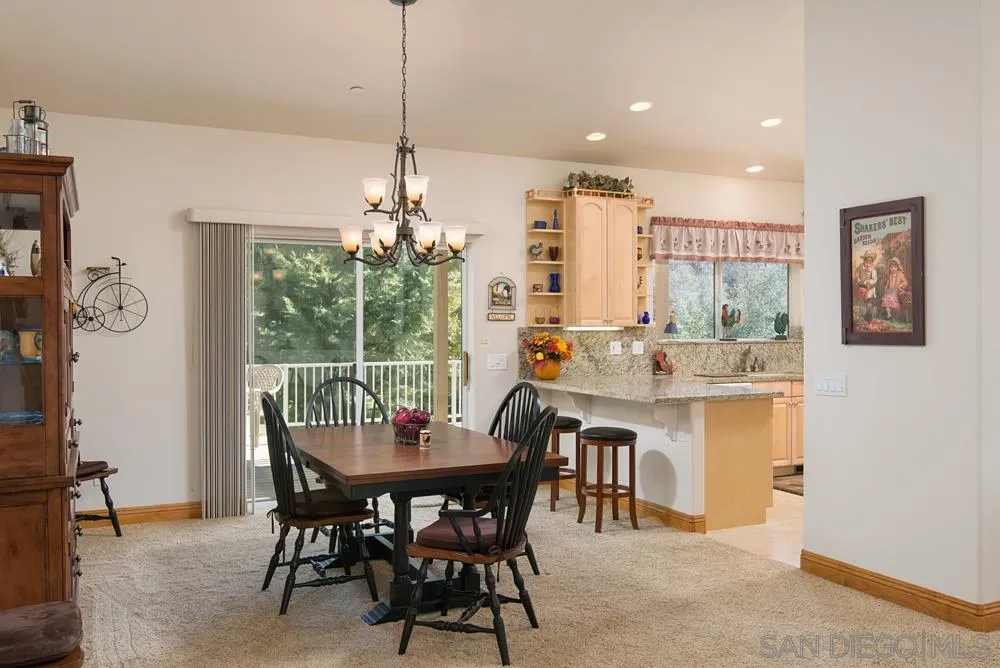 1295 Banner Road Julian, CA 92036 - Photo 12 of 25 a dining room with furniture a chandelier and window