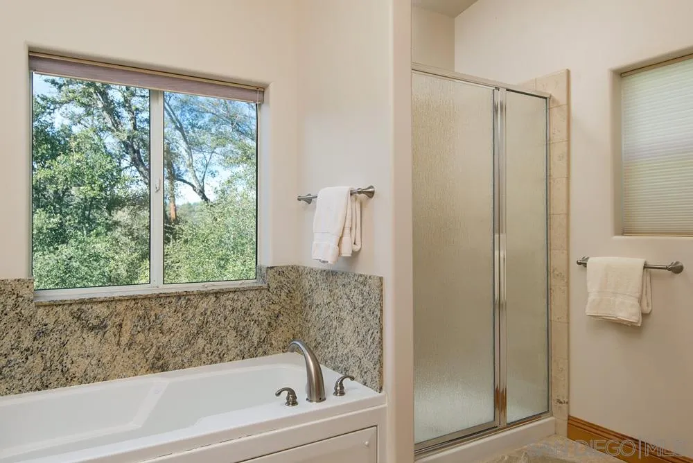 1295 Banner Road Julian, CA 92036 - Photo 18 of 25 a bathroom with a bathtub and shower