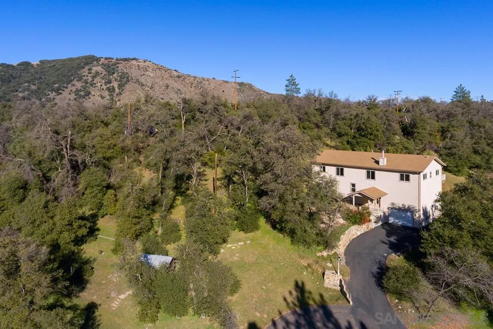 1295 Banner Road Julian, CA 92036 - Photo 3 of 25 a view of a house with a mountain in the background
