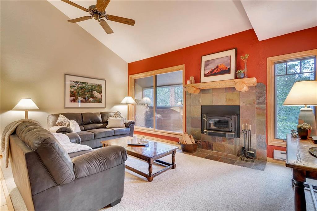 800 Columbine Road, Unit B9 Breckenridge, CO 80424 - Photo 1 of 25 a living room with furniture and a fireplace