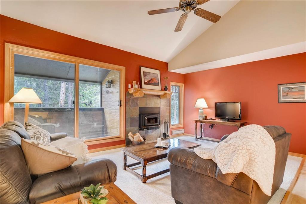 800 Columbine Road, Unit B9 Breckenridge, CO 80424 - Photo 2 of 25 a living room with furniture and a fireplace