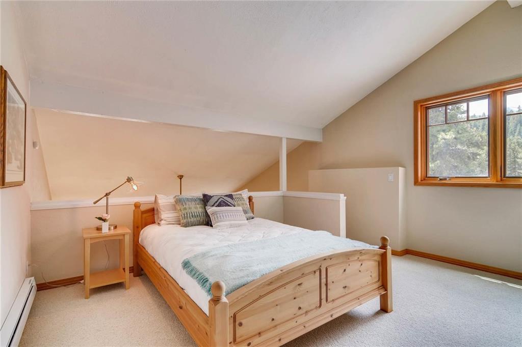 800 Columbine Road, Unit B9 Breckenridge, CO 80424 - Photo 18 of 25 a bedroom with a bed and window
