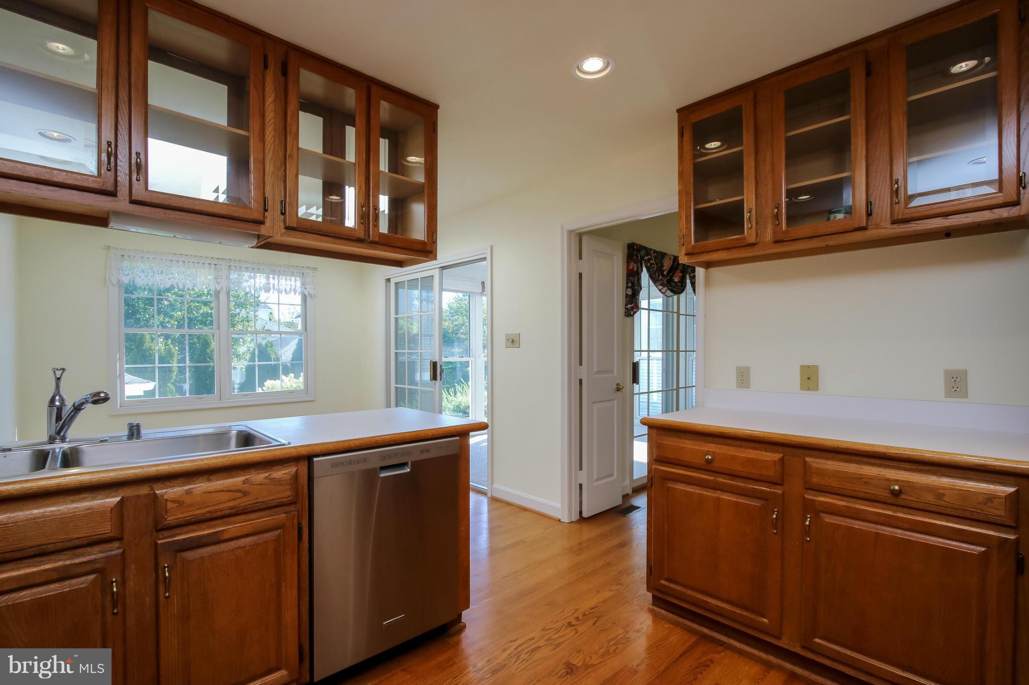 2446 Five Shillings Road Frederick, MD 21701 - Photo 11 of 30 a kitchen with stainless steel appliances granite countertop a sink and cabinets