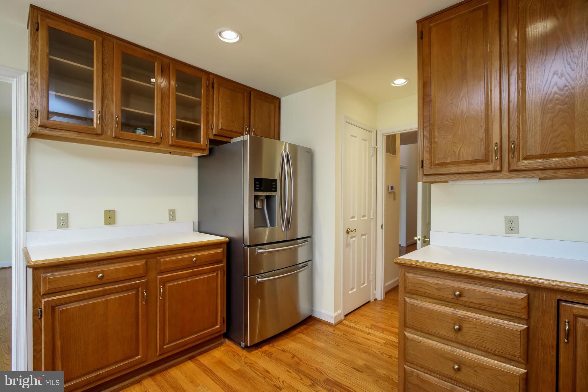 2446 Five Shillings Road Frederick, MD 21701 - Photo 12 of 30 a kitchen with stainless steel appliances granite countertop a refrigerator and a stove top oven