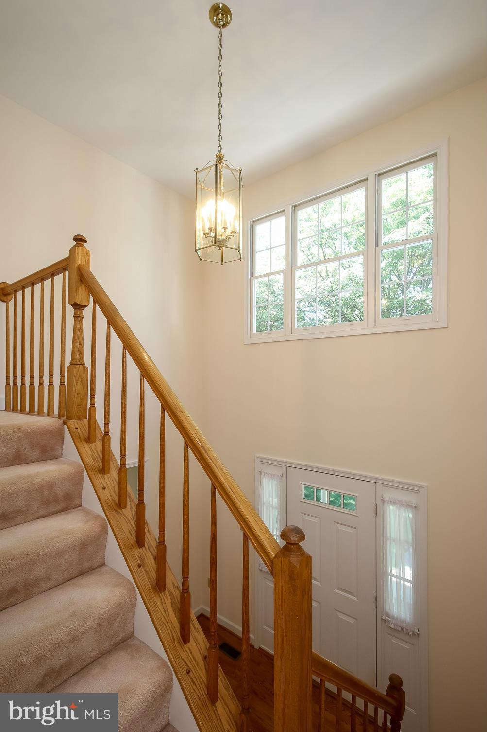2446 Five Shillings Road Frederick, MD 21701 - Photo 26 of 30 a view of staircase with railing and a chandelier
