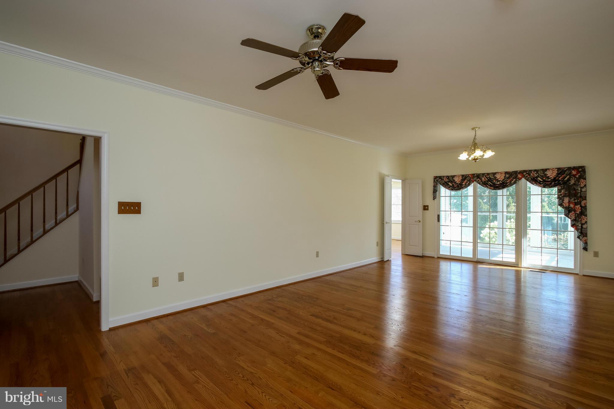 2446 Five Shillings Road Frederick, MD 21701 - Photo 8 of 30 a view of an empty room with wooden floor