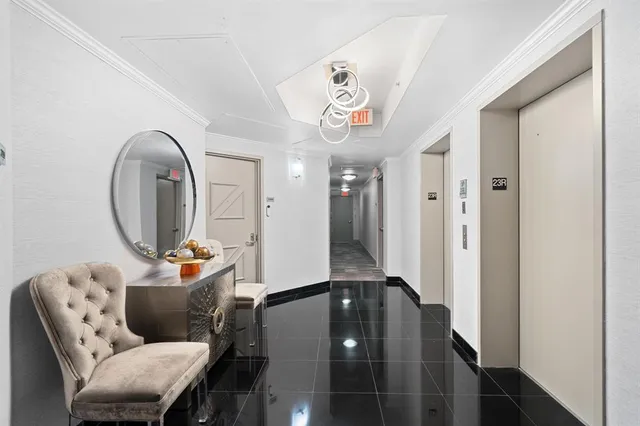 a living room with furniture and a mirror