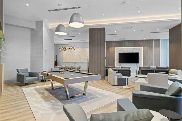 a white bath tub sitting next to a bathroom sink